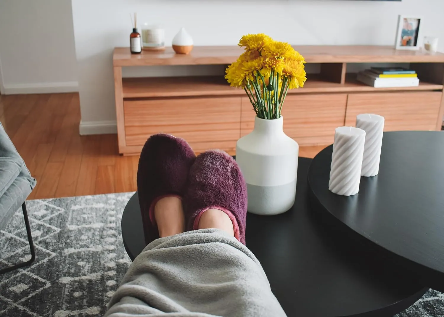 slide on Aromatherapy women's slippers featuring heatable lavender-filled aromatherapy insoles. Spa-style slide-on slippers with a fuzzy faux fur exterior.
