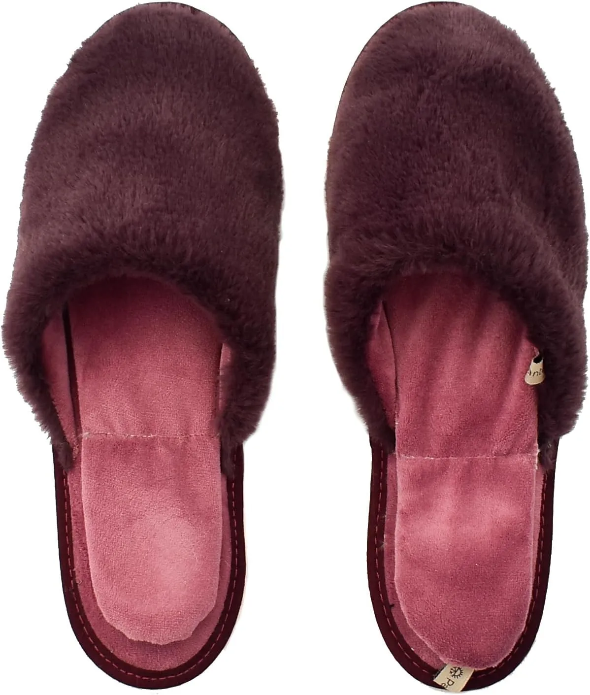 slide on Aromatherapy women's slippers featuring heatable lavender-filled aromatherapy insoles. Spa-style slide-on slippers with a fuzzy faux fur exterior.